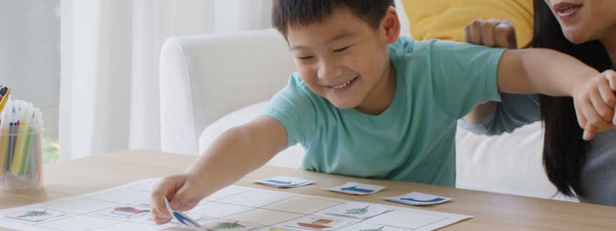 Playful boy with cards