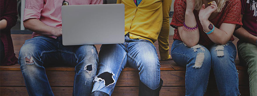 Group of teens with a laptop