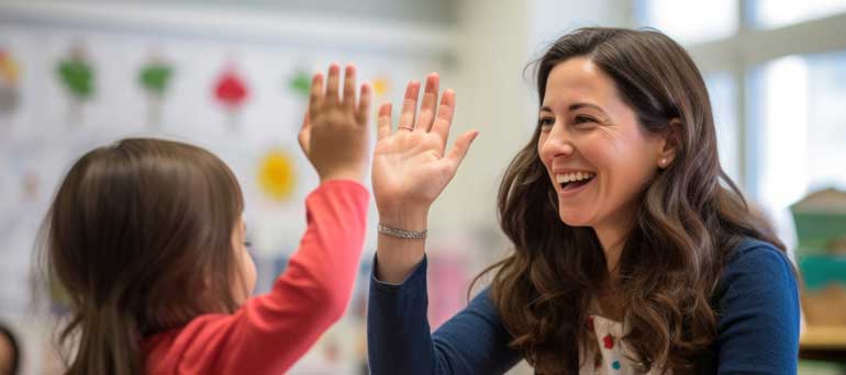 Teacher high fives a student
